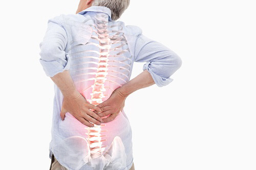 Highlighted spine of man with back pain