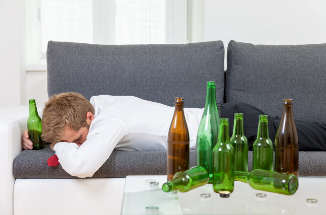 Depressed businessman drunk at home