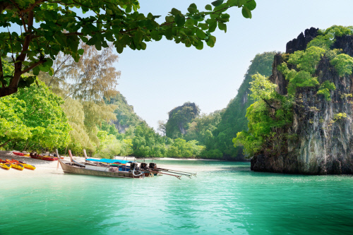 long boats on island in Thailand
